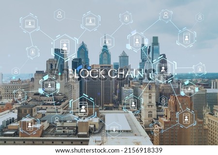 Aerial panorama city view of Philadelphia financial downtown at day time, Pennsylvania, USA. Decentralized economy. Blockchain, cryptocurrency and cryptography concept, hologram