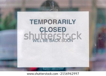 Temporarily closed sign on a glass wall at Silicon Valley, San Jose, California Royalty-Free Stock Photo #2156962997