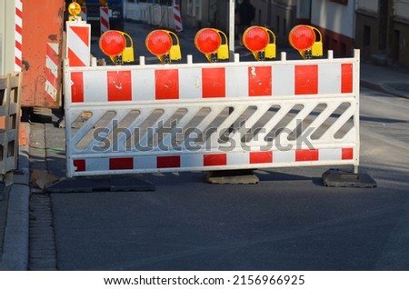 A view of portable road barriers on a street 