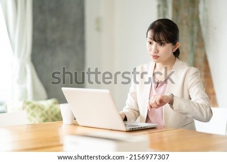 Business woman operating a personal computer