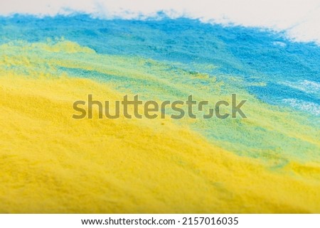 Ukrainian flag colours. Blue and yellow background from holi powder paint. 