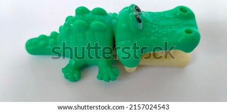 plastic toy animals isolated on white background.toy crocodile.