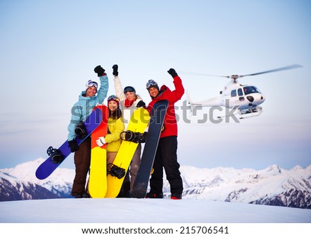 Snowboarders on top of the Mountain with Heli Ski Royalty-Free Stock Photo #215706541