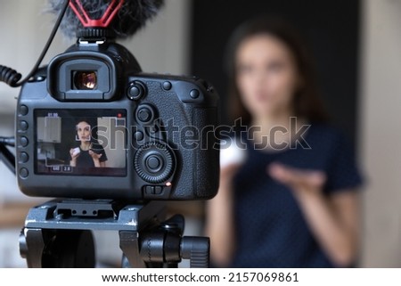 Young beauty blogger girl recording video on dslr camera, shooting post at home for vlog. Vlogger, influencer recording product presentation, filming review for channel. Screen close up Royalty-Free Stock Photo #2157069861