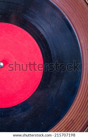 Old dusted vinyl record on Turntable very close up view