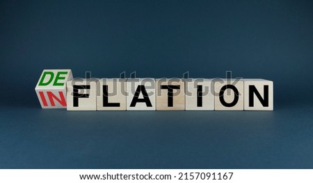 Inflation or Deflation The cubes form the choice words Inflation or Deflation. Concept of Inflation or Deflation Royalty-Free Stock Photo #2157091167