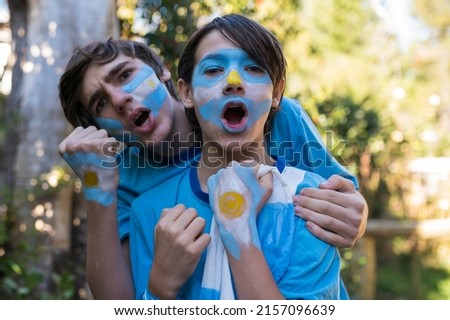 Two brothers shouting the winning goal. Royalty-Free Stock Photo #2157096639