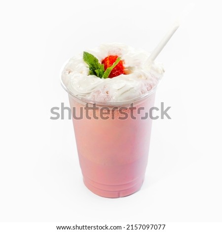 Cool delicious milkshake with strawberry flavor and whipped cream with berries. Close-up, on a white background. Mock up.