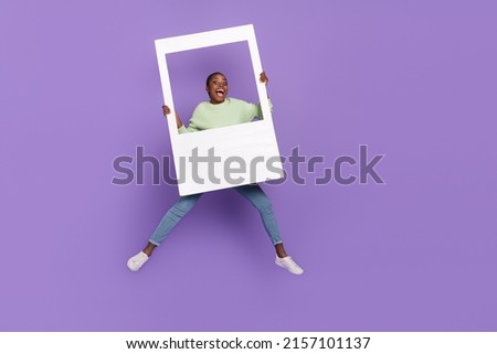 Full length photo of overjoyed good mood female take polaroid photo of herself isolated on violet color background