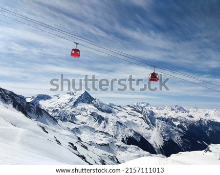 A beautiful view of the La Plagne glacier cable car on a sunny day in Alpes, France Royalty-Free Stock Photo #2157111013