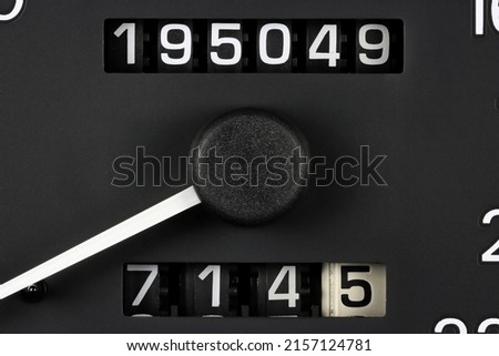 odometer of used car showing mileage of 195049 km Royalty-Free Stock Photo #2157124781