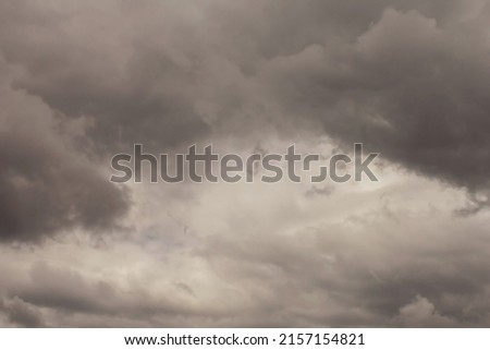 Summer cloudy sky background. Panoramic view with beautiful clouds. Horizontal cloudscape. High-resolution photography. Design element. Selective focus. Copy space. 