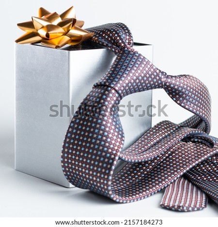 The representation of Father's Day with still life - tie and gift box Royalty-Free Stock Photo #2157184273