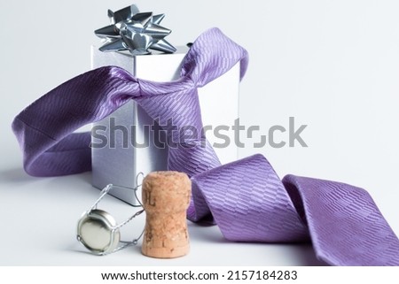 The representation of Father's Day with still life - tie, gift box and a champagne lid Royalty-Free Stock Photo #2157184283