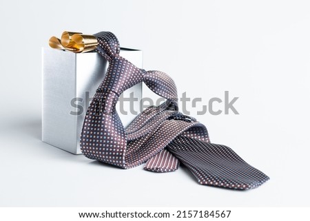 The representation of Father's Day with still life - tie and gift box Royalty-Free Stock Photo #2157184567