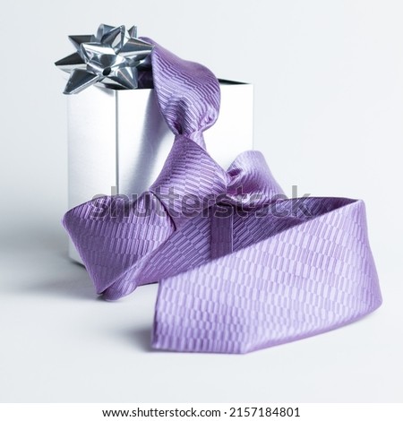 The representation of Father's Day with still life - tie and gift box Royalty-Free Stock Photo #2157184801