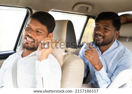 commuter talking to cab driver about location - concept of traveling on taxi, communication, journey and transportation. Royalty-Free Stock Photo #2157186557