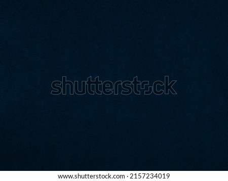 Dark blue velvet fabric texture used as background. Empty dark blue fabric background of soft and smooth textile material. There is space for text.	