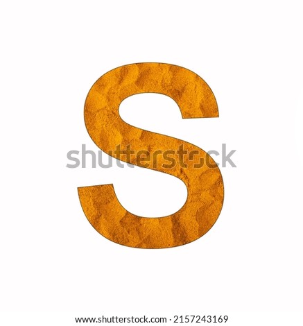Alphabet letter S - Turmeric powder background