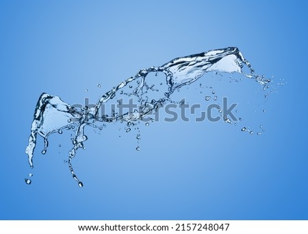 Splash of pure water on light blue background