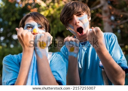 Brothers encouraging the Argentina team. Royalty-Free Stock Photo #2157255007
