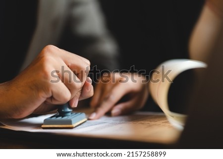 business approve and certificate concept, confirmation of business marketing document permit and certified stamping, signing on business partner paper to success, or concept of attorney and insurance Royalty-Free Stock Photo #2157258899