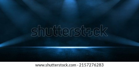 Rays, spotlights light. Empty dark scene with blue light. Asphalt blue dark street with smoke. Royalty-Free Stock Photo #2157276283