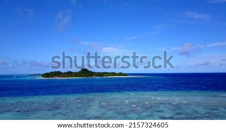 A scenic view of turquoise sea on a sunny day