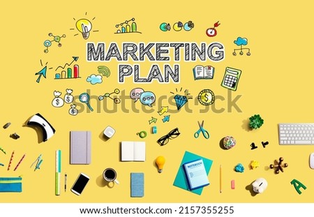 Marketing plan with collection of electronic gadgets and office supplies
