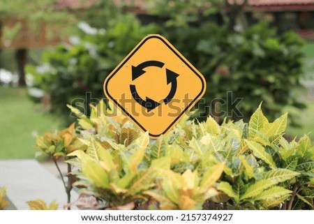 road sign of a roundabout