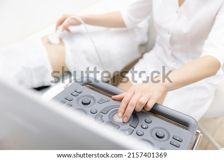 Professional doctor woman use ultrasound scanner device for examining patient female, top view. Royalty-Free Stock Photo #2157401369