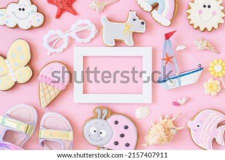 Bright creative layout made of white frame and ute summer symbols on pink background. Copy space, Top view, Flat lay. Creative summer concept.