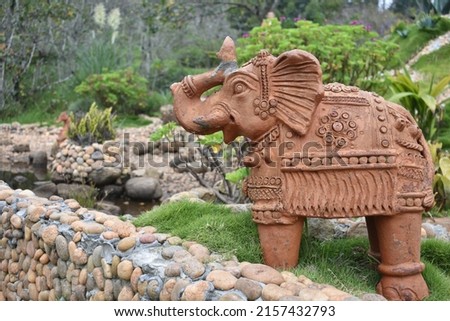 soil sculpture of elephant in garden