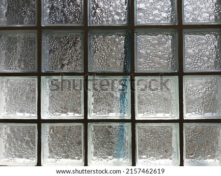 Clear glass blocks reflect the afternoon sunlight.


