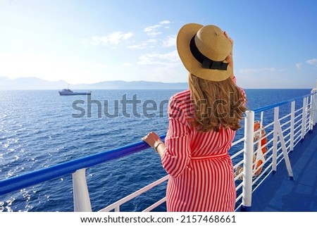 Cruise ship vacation holiday. Back view of relaxed fashion woman enjoying travel on cruise liner. Royalty-Free Stock Photo #2157468661