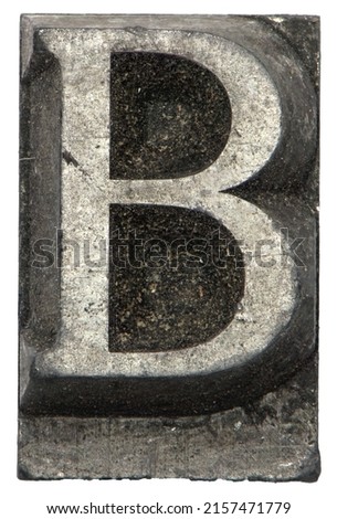 typeset letterpress vintage retro close up of lead capitol letter B from print shop on white background