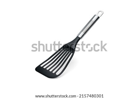 Nonstick Fish Spatula Turner, Thin Slotted Spatula, Wide Nylon Blade Lightweight but Sturdy Kitchen Fish Spatula, Designed for Non-stick Pan, Black at an angle Royalty-Free Stock Photo #2157480301