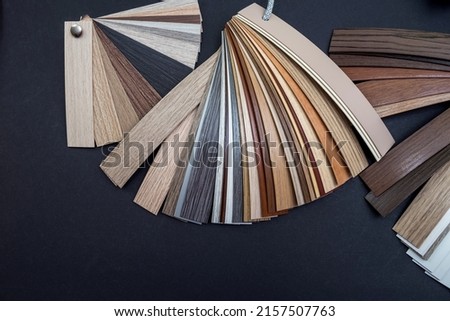 wooden veneer samples isolated on black background. Copy space