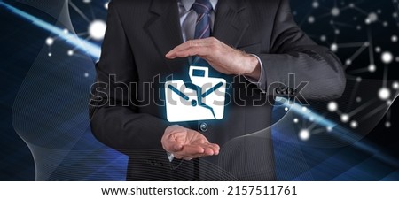 Job loss insurance concept with businessman in a protective gesture Royalty-Free Stock Photo #2157511761
