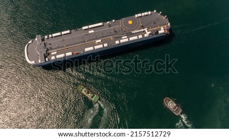 Aerial view vehicle car carrier vessel loading car for shipping to worldwide, Large RoRo Roll on off vehicle car carrier, Vehicle car carrier for import export around the world. Royalty-Free Stock Photo #2157512729