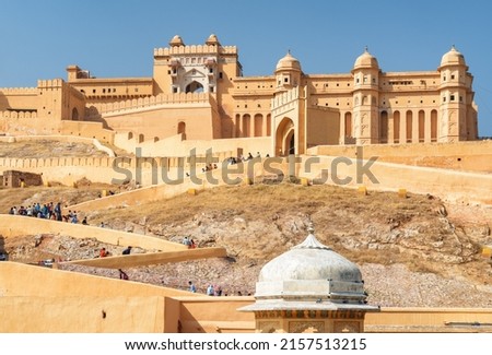 Gorgeous view of the Amer Fort and Palace (Amber Fort) on blue sky background in Jaipur, Rajasthan, India. Rajput military hill architecture. Jaipur is a popular tourist destination of South Asia. Royalty-Free Stock Photo #2157513215