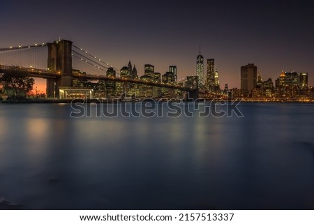 A scenic night view of the Brooklyn Bridge in New York City