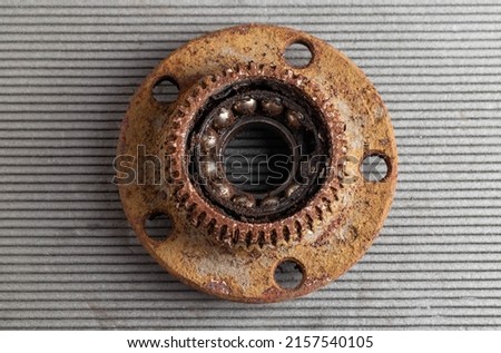 Old rusty wheel hub with a broken bearing. Bearing jamming. Automotive Part