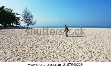 A photo of a woman from the UK working out in Koh Samui, Thailand, Asia