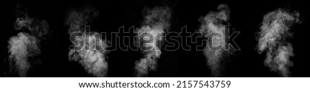 A set of five different types of swirling smoke, steam, isolated on a black background for overlaying on your photos. Collection of vertical vapors. Abstract smoky background
