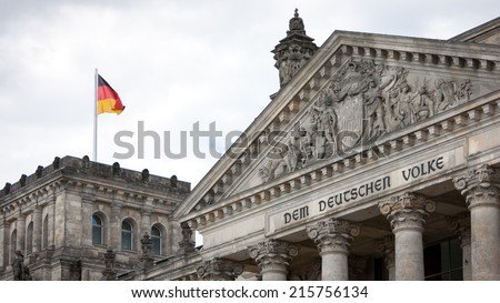 Reichstag, Berlin, Germany. The dedication on the face of the German parliament building, Dem Deutschen Volke, translates as "To the German People". Royalty-Free Stock Photo #215756134