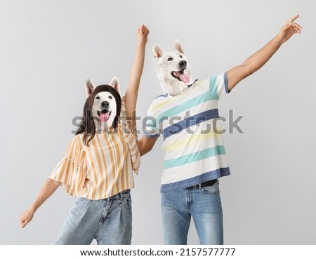 Funny dancing dogs with human bodies on grey background