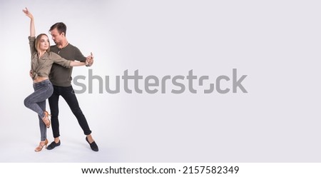 Couple dancing social dance. Kizomba bachata or semba salsa or taraxia on white background with copy space banner and place for text - Social dance concept. Royalty-Free Stock Photo #2157582349