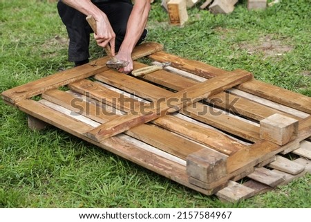 Dismantle Pallet. Disassembly pallets. pallets creative ideas Royalty-Free Stock Photo #2157584967