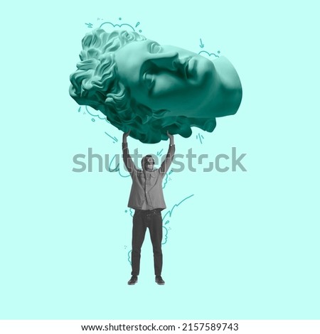 Craving for art. Eras comparison. Young man carries a huge ancient statue head isolated on light background. Concept of art, creativity, retro style, surrealism. Copy space for ad